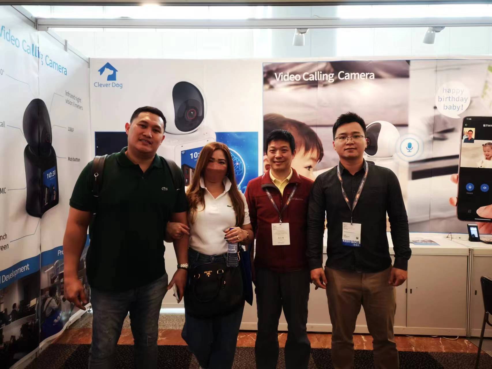 Cylan team meeting visitors at a video calling camera exhibition booth