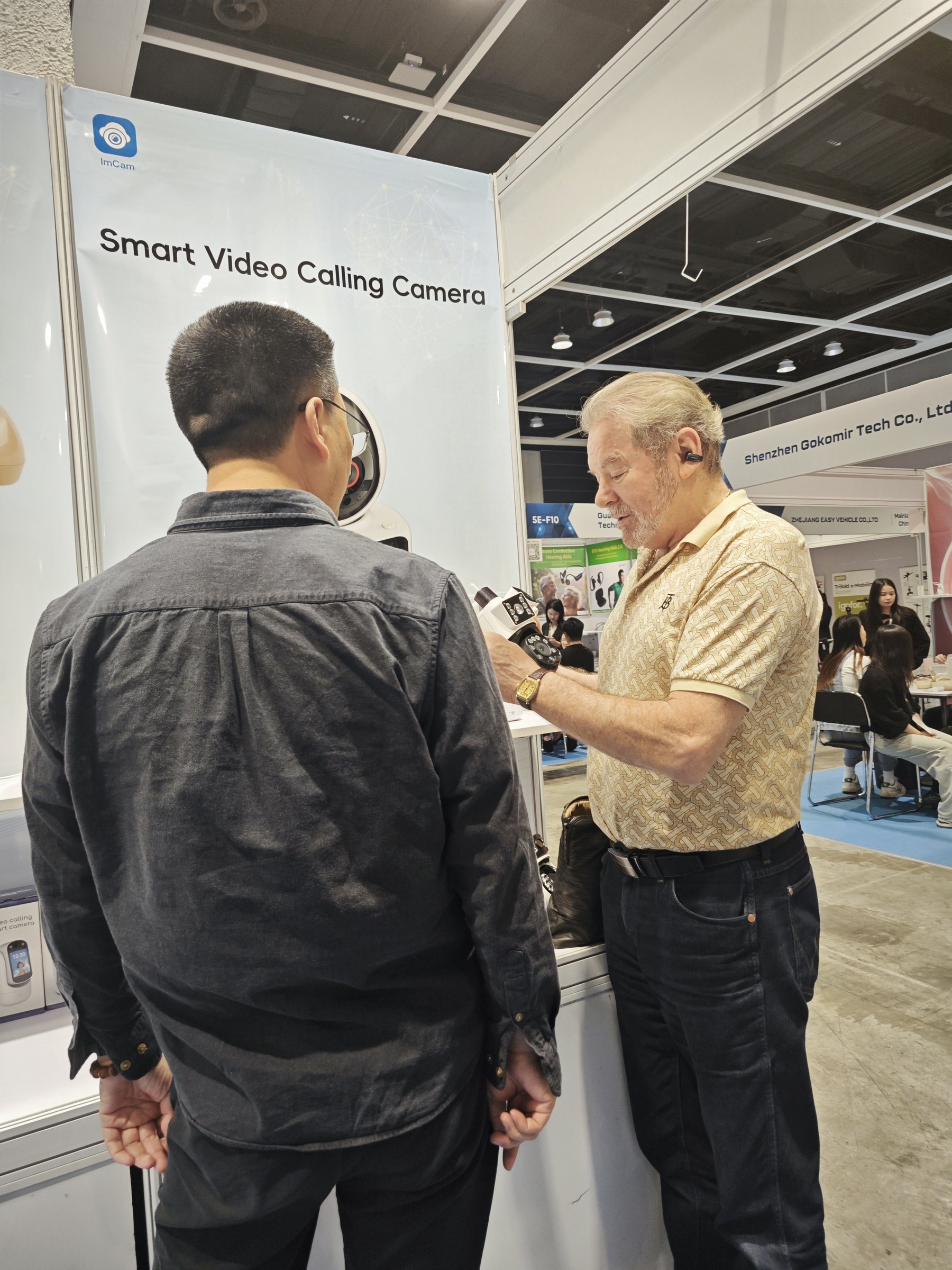 Visitor discussion at a Cylan exhibition booth
