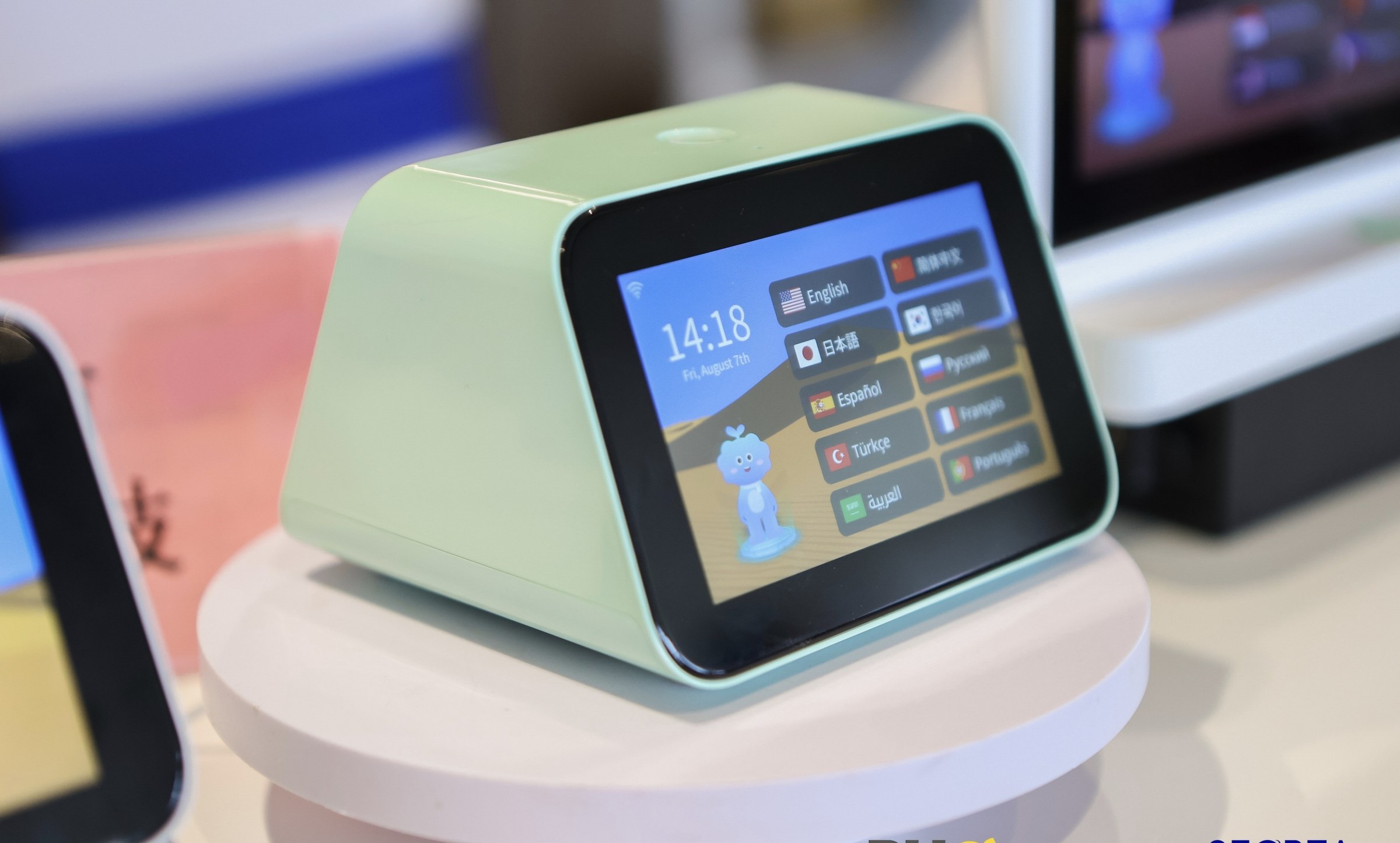 Green IM Mate portable translator on display