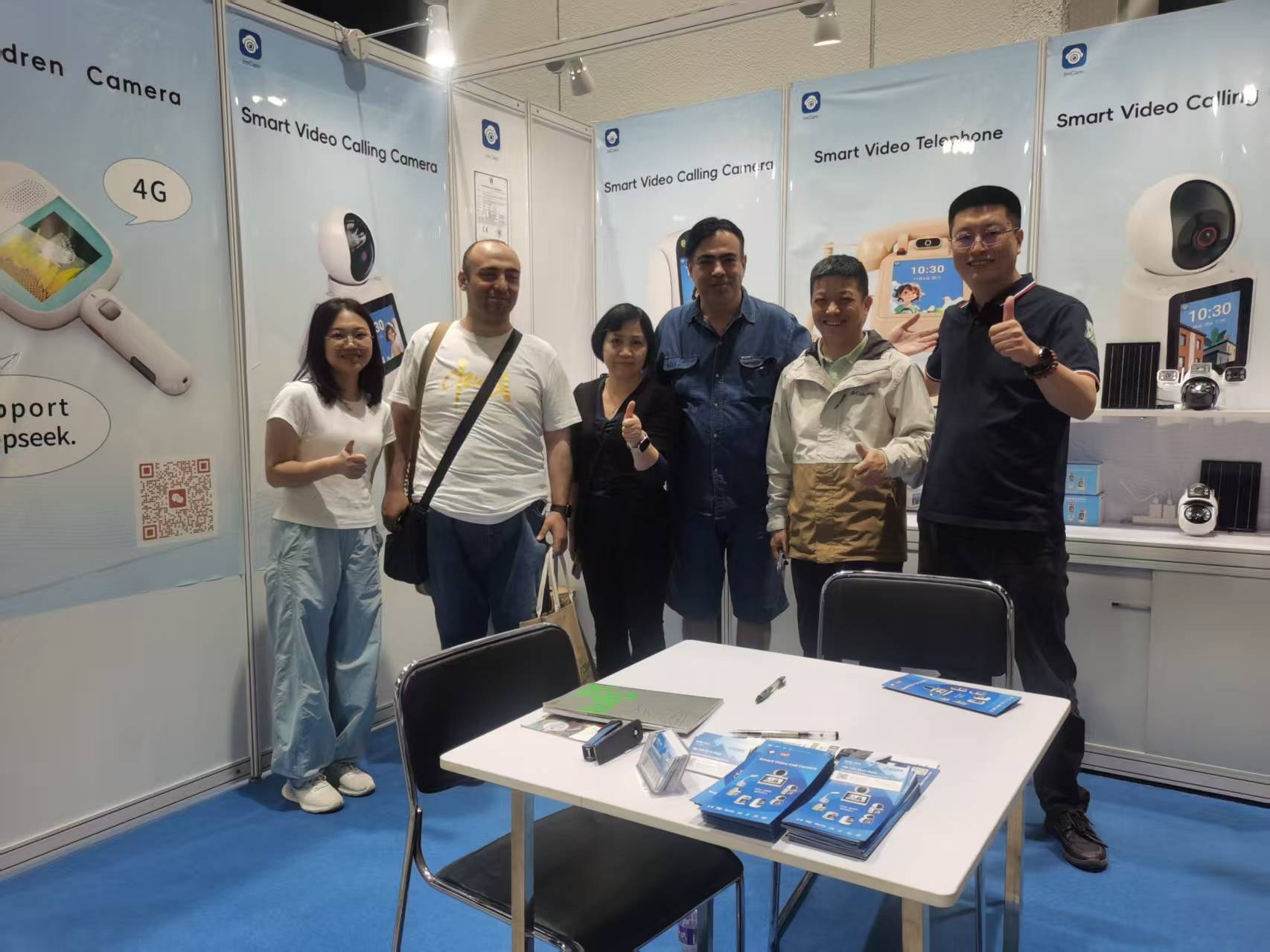Cylan team with visitors at a video communication exhibition